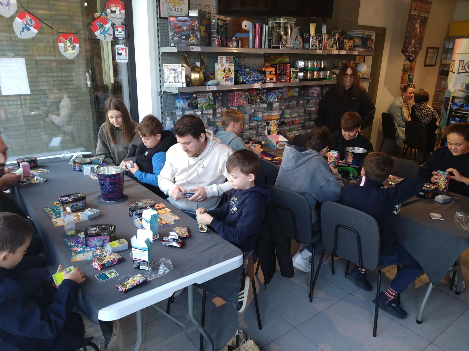 People playing Pokémon Trading Card game in nerdgeek People playing Pokémon Trading Card game in nerdgeek